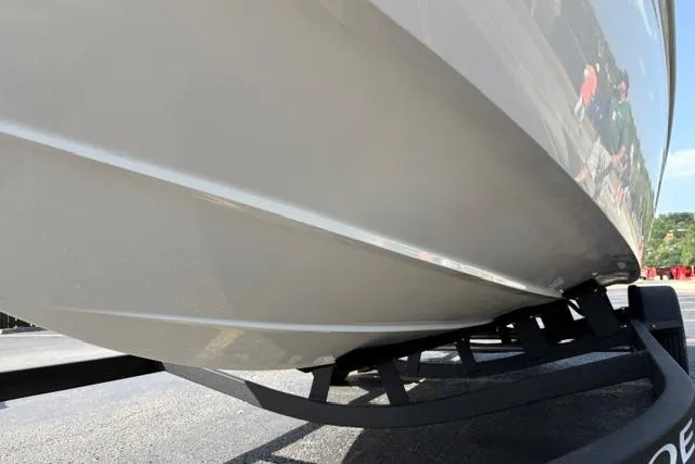 Slide: The Image of 2024 Tahoe T21 boat hull on trailer, close-up view. - 28