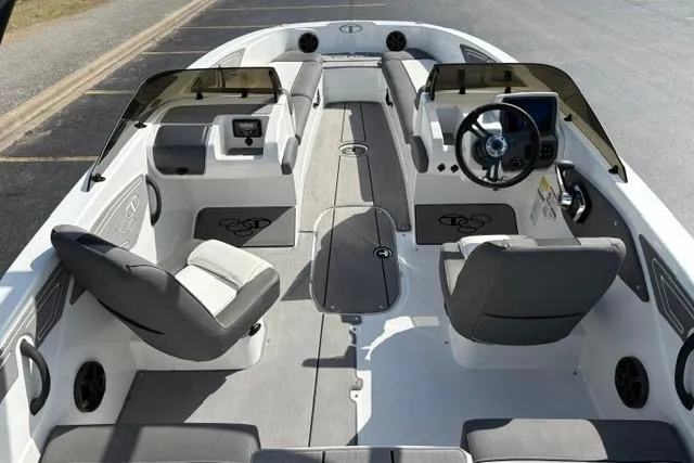 Slide: The Image of 2024 Tahoe T21 boat interior with modern seating and steering console. - 13