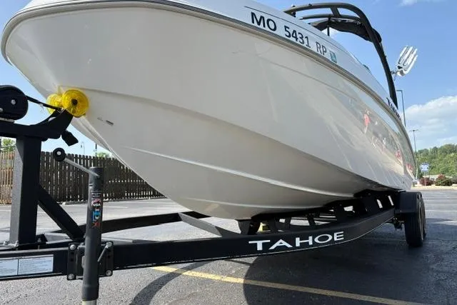 Slide: The Image of 2024 Tahoe T21 boat on trailer in parking lot, side view. - 7