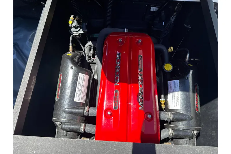 Slide: The Image of 2015 Axis A20 boat engine, featuring a Monsoon 350 with red cover. - 25