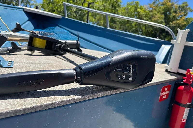 Slide: The Image of Close-up of a 2004 Klamath 16 Alaskan boat deck with motor handle. - 14