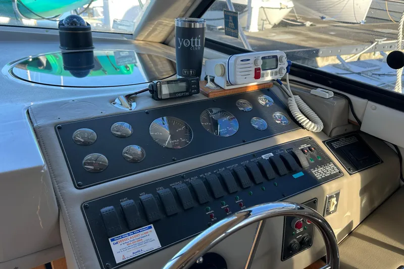 Slide: The Image of Control panel of a 2000 Bayliner 4087 Aft Cabin Motoryacht with gauges and radio equipment. - 19