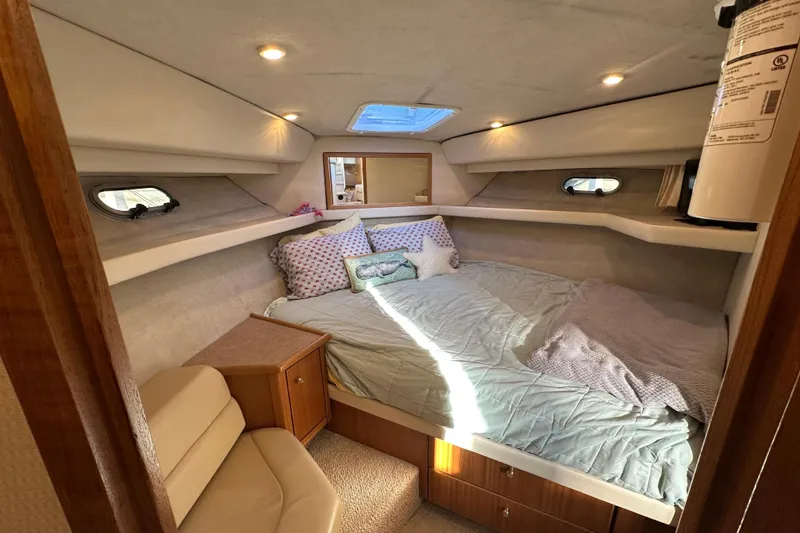 Slide: The Image of Cozy cabin interior of 2000 Bayliner 4087 Aft Cabin Motoryacht with bed and seating. - 33