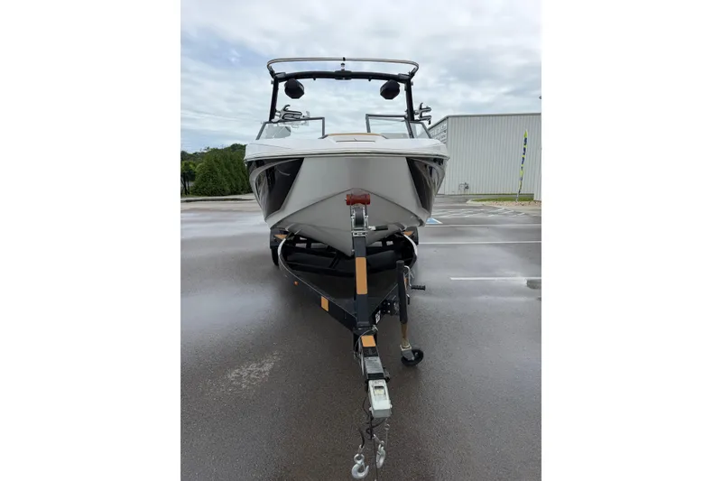 Slide: The Image of 2023 Tigé Z1 boat on trailer in parking lot, overcast sky. - 5