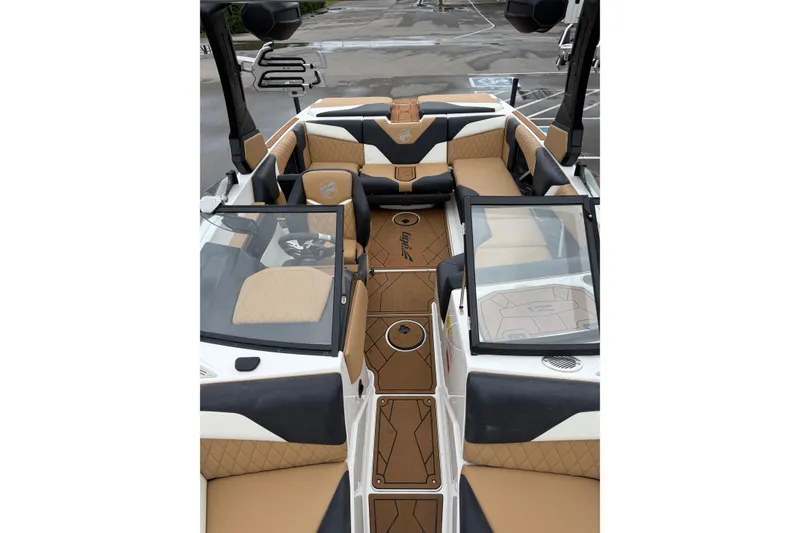 Slide: The Image of 2023 Tigé Z1 boat interior with tan and black seating, sleek design, and modern features. - 7
