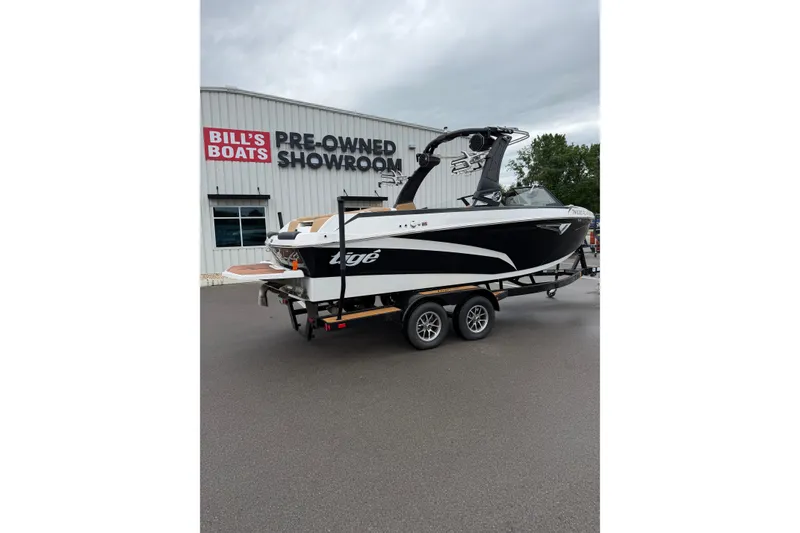 Slide: The Image of 2023 Tigé Z1 boat on trailer at Bill's Boats showroom. - 1