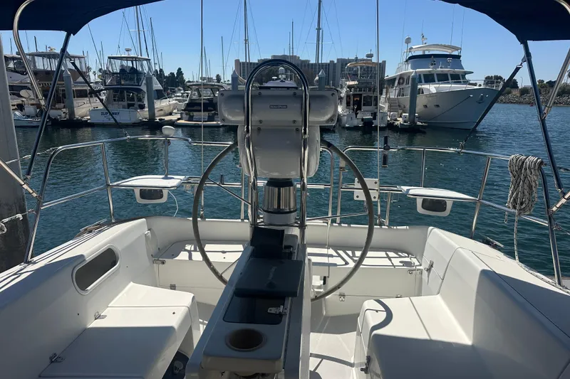 Slide: The Image of Cockpit view of a 2005 Catalina 36 MkII sailboat docked in a marina. - 3