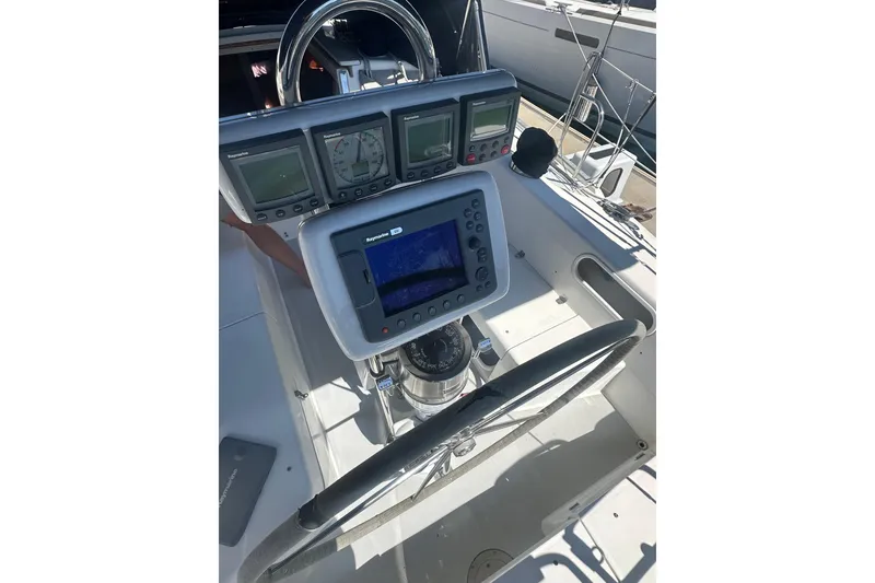Slide: The Image of Cockpit of 2005 Catalina 36 MkII sailboat with navigation instruments and steering wheel. - 2