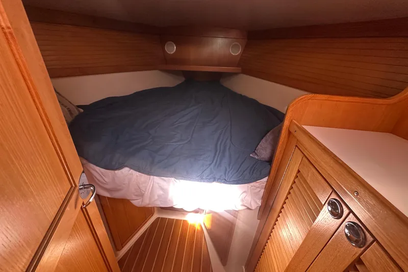 Slide: The Image of Cozy cabin interior of 2005 Catalina 36 MkII sailboat with wooden finishes and bed. - 10