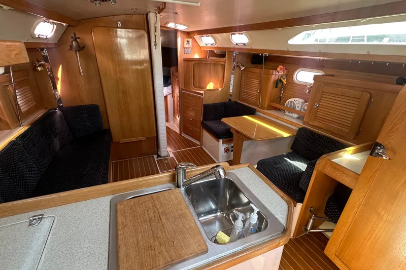 Slide: The Image of Interior of a 2005 Catalina 36 MkII sailboat with wood finishes and seating area. - 7
