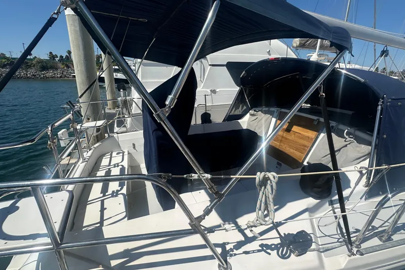 Slide: The Image of 2005 Catalina 36 MkII sailboat cockpit with blue canopy and polished railings. - 16