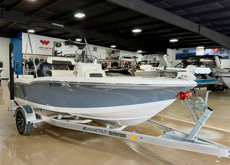 Slide: The Image of A 2024 Tidewater 180 CC Adventure boat on a trailer in a showroom. - 2