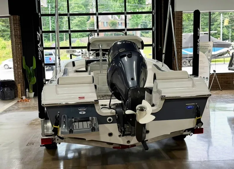 Slide: The Image of The image shows a 2024 Tidewater 180 CC Adventure boat in a showroom. - 5