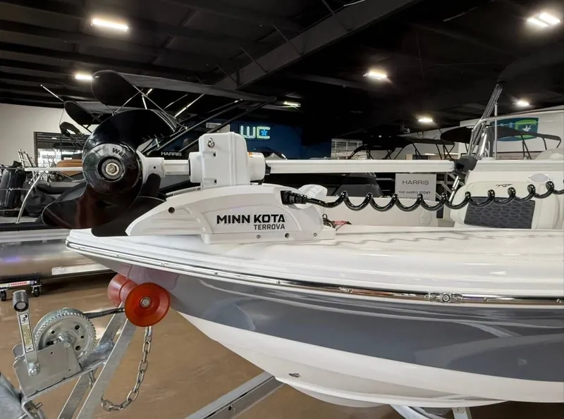 Slide: The Image of A 2024 Tidewater 180 CC Adventure boat with Minn Kota Terrova motor, on a trailer indoors. - 6