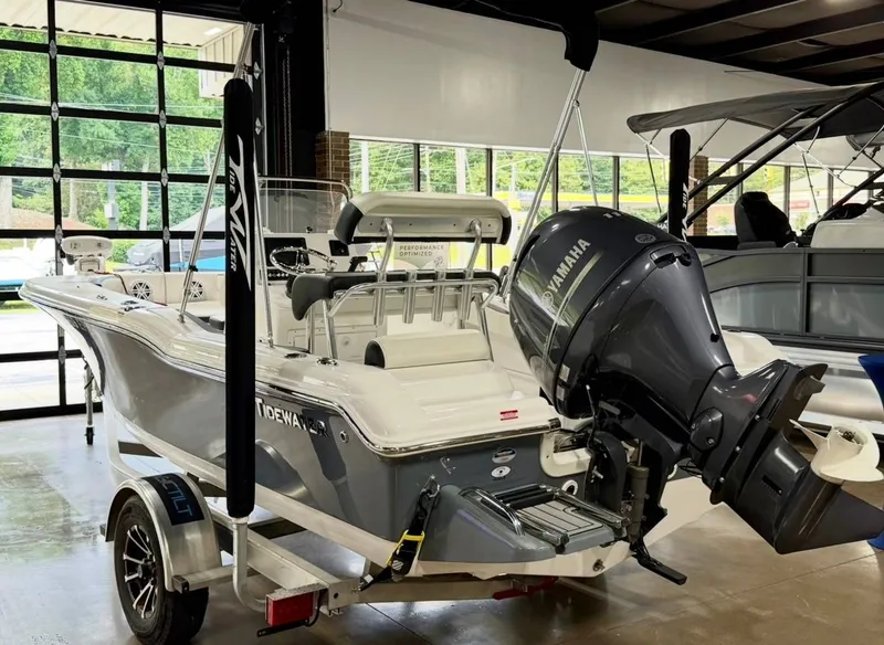 Slide: The Image of 2024 Tidewater 180 CC Adventure in a showroom, featuring a Yamaha outboard motor. - 3