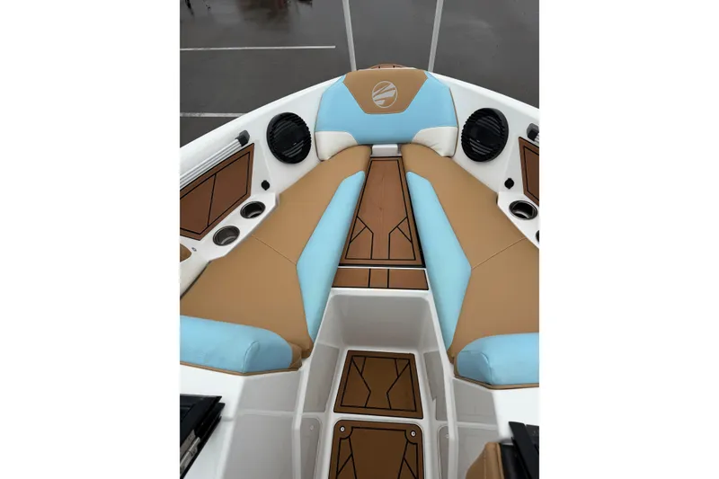 Slide: The Image of 2023 Tigé Z1 boat interior with tan and blue seating, featuring modern design elements. - 10