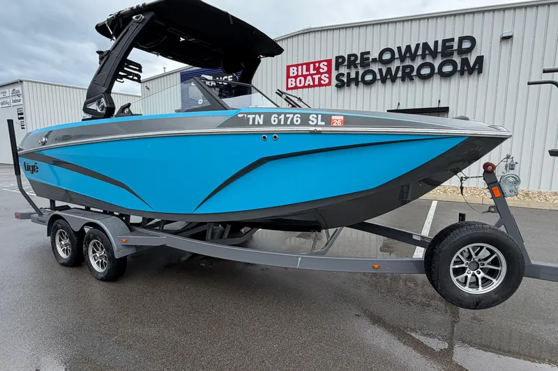 The Image of 2023 Tigé Z1 boat in vibrant blue at Bill's Boats pre-owned showroom. - 0