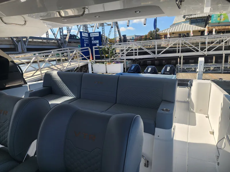 Slide: The Image of The image shows the cockpit of a 2027 Cruisers Yachts 45VTR with gray upholstery and a modern design. - 38