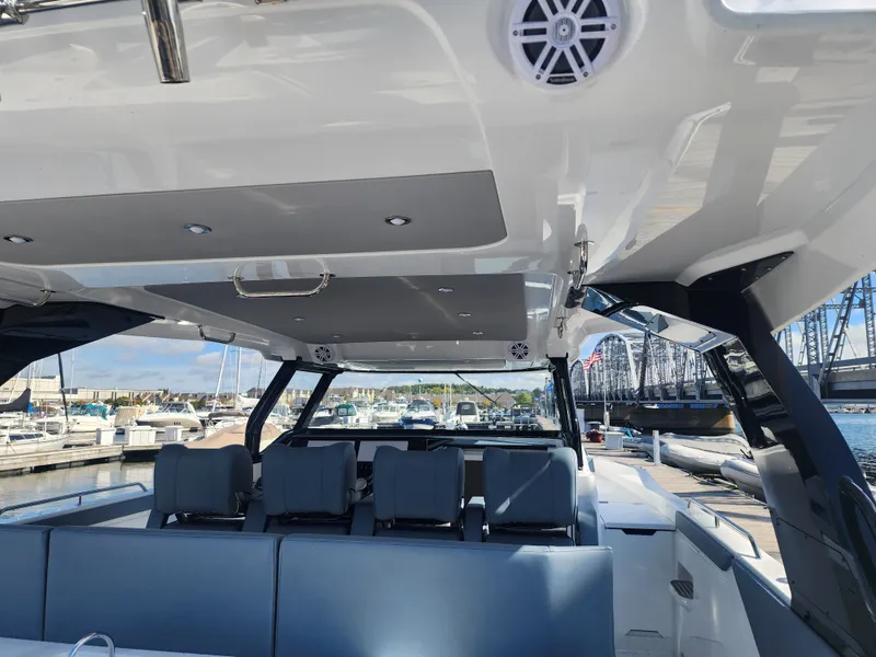 Slide: The Image of The image shows the cockpit of a 2027 Cruisers Yachts 45VTR with blue seating and a modern design. - 33
