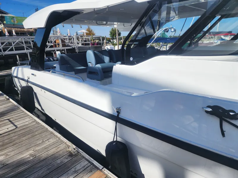 Slide: The Image of The 2027 Cruisers Yachts 45VTR is docked. It features a sleek, modern design with elegant lines. - 2