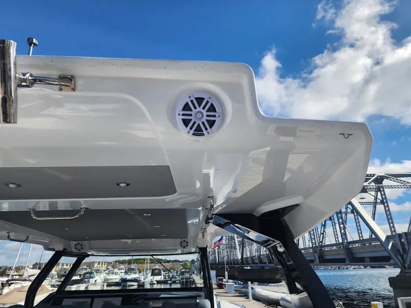 Slide: The Image of The image shows the deck of a 2027 Cruisers Yachts 45VTR with a speaker and bridge in the background. - 31