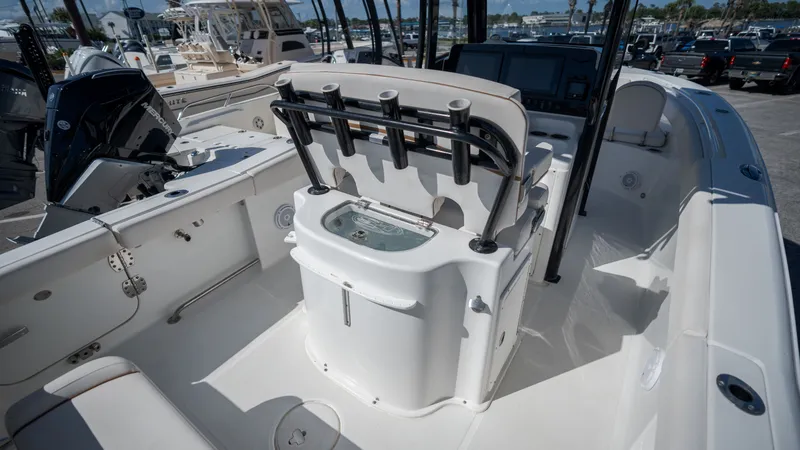 Slide: The Image of The image shows the cockpit of a 2020 Sea Hunt Gamefish 25 boat with rod holders and a helm station. - 25