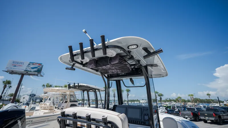 Slide: The Image of A 2020 Sea Hunt Gamefish 25 with T-top and fishing rod holders at the harbor. - 15