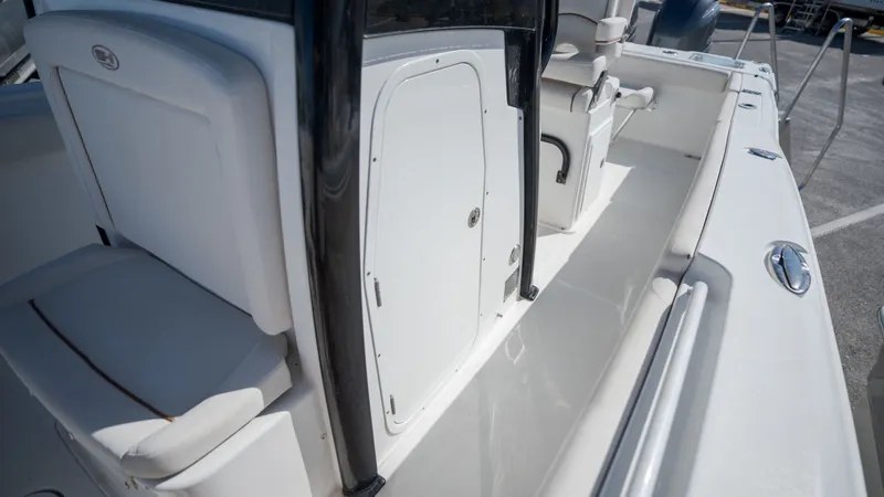 Slide: The Image of The image shows the deck of a 2020 Sea Hunt Gamefish 25 boat with white seating. - 14