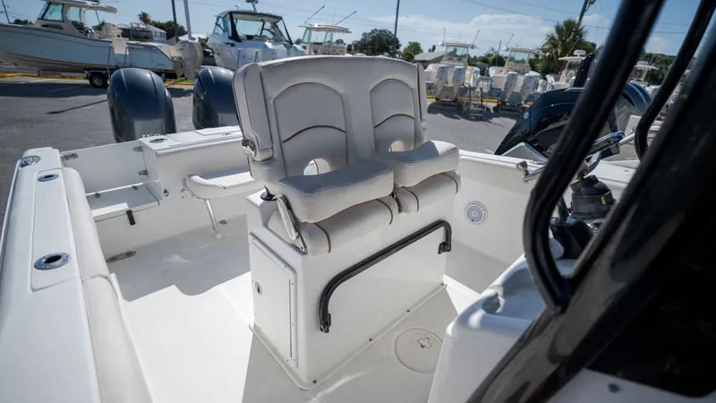 Slide: The Image of The image shows the cockpit of a 2020 Sea Hunt Gamefish 25 boat with dual seating. - 23