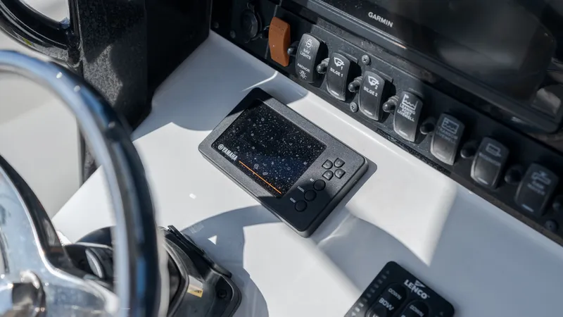 Slide: The Image of Close-up of a Sea Hunt Gamefish 25 helm with modern instruments. - 19