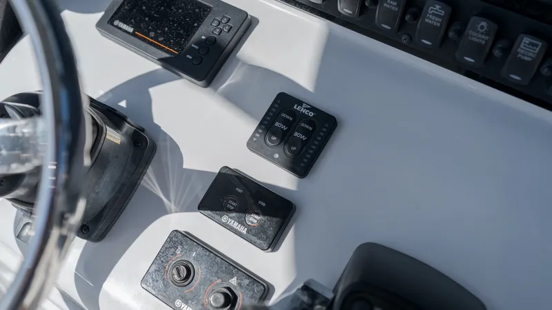 Slide: The Image of Close-up of the helm of a Sea Hunt Gamefish 25 boat with various instruments. - 20