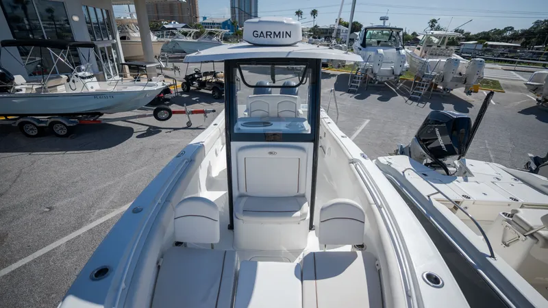 Slide: The Image of A 2020 Sea Hunt Gamefish 25 with a spacious cockpit and Garmin navigation system. - 13