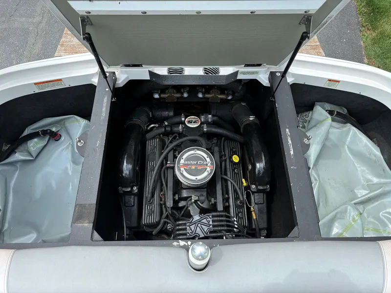 Slide: The Image of Engine compartment of a 2011 MasterCraft X2 boat with open hatch. - 25