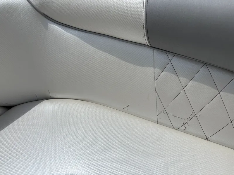 Slide: The Image of Close-up of a boat seat with cracks in the upholstery. - 21