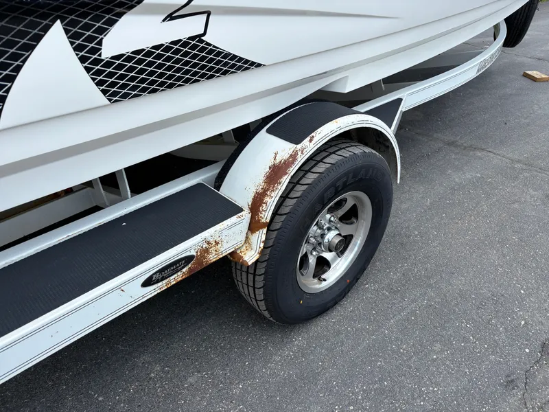 Slide: The Image of Close-up of a boat trailer with rust on the fenders. - 7