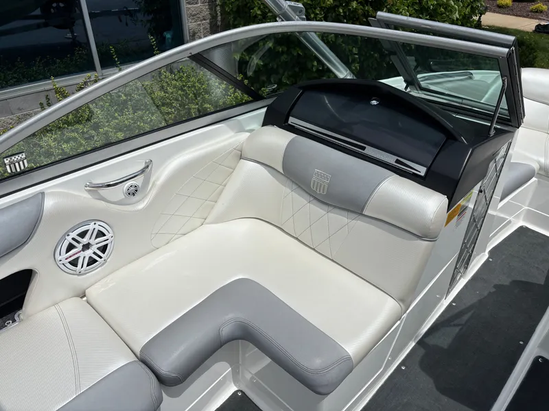 Slide: The Image of The image shows the cockpit of a 2011 MasterCraft X2 with white and gray seating. - 15