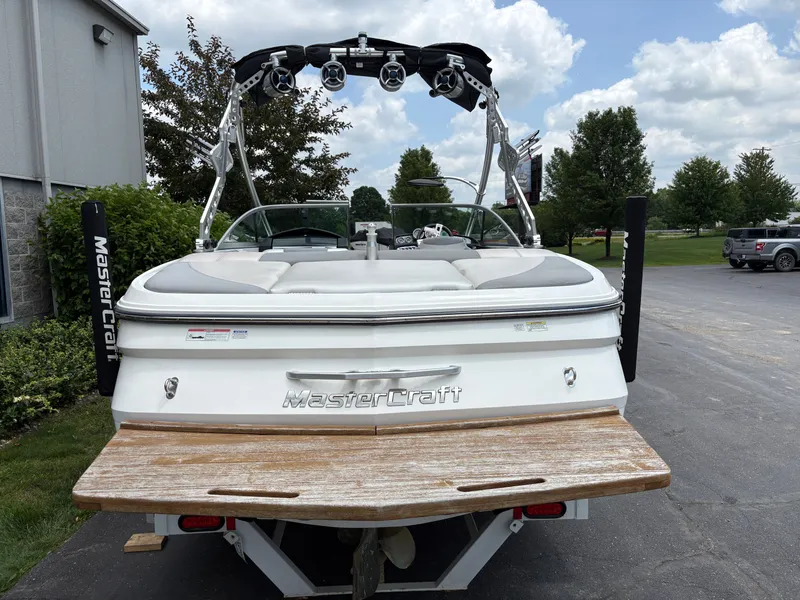 Slide: The Image of Rear view of a white 2011 MasterCraft X2 boat with tower and speakers. - 9