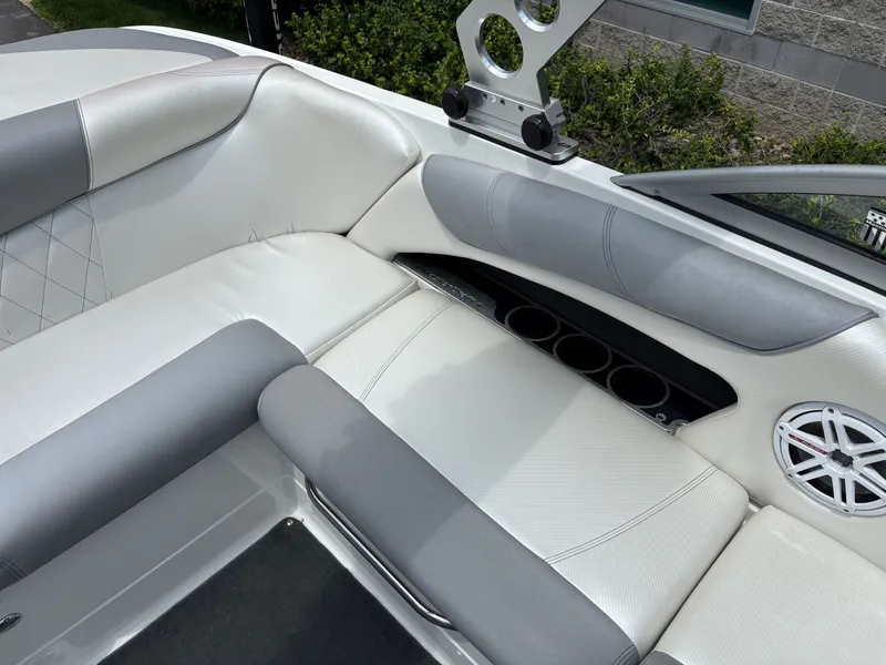 Slide: The Image of Interior of a 2011 MasterCraft X2 boat with white and gray seating. - 16