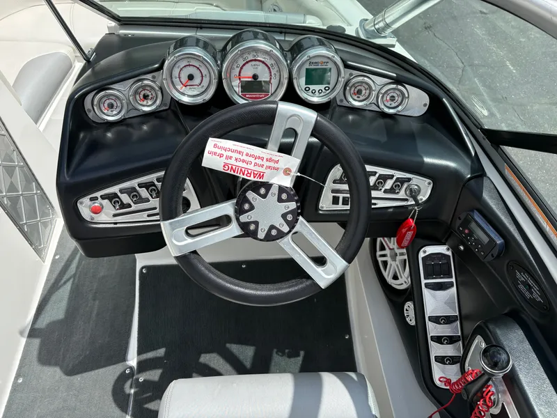 Slide: The Image of The image shows the cockpit of a 2011 MasterCraft X2 with a modern dashboard. - 14