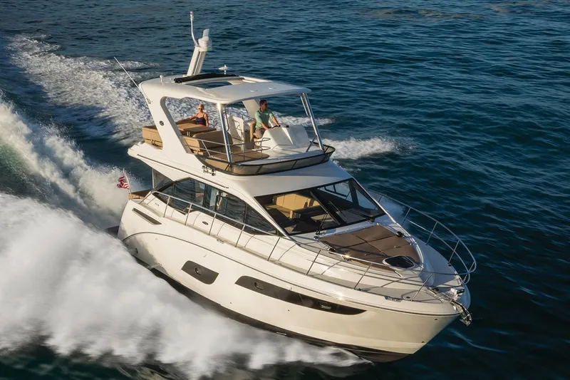 Slide: The Image of Manufacturer Provided Image: 2018 Sea Ray Fly 460 yacht cruising on open water. - 1