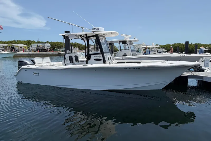 The Image of 2019 Sea Hunt Gamefish 27 Coffin Box boat docked in a marina. - 0