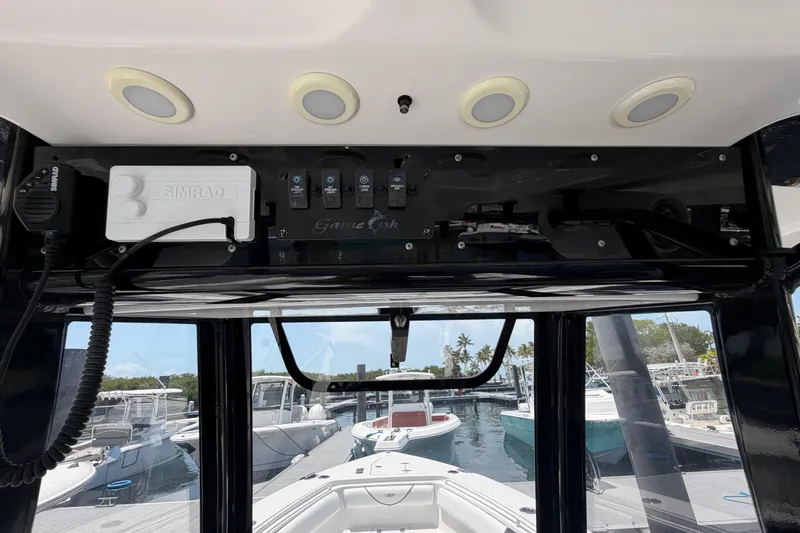 Slide: The Image of 2019 Sea Hunt Gamefish 27 Coffin Box dashboard with Simrad electronics at marina. - 31