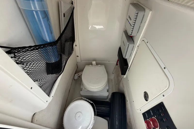 Slide: The Image of Interior of 2019 Sea Hunt Gamefish 27 Coffin Box with marine toilet and storage. - 32