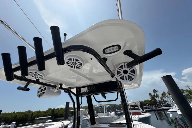 Slide: The Image of 2019 Sea Hunt Gamefish 27 Coffin Box boat with rod holders and speakers at marina. - 10