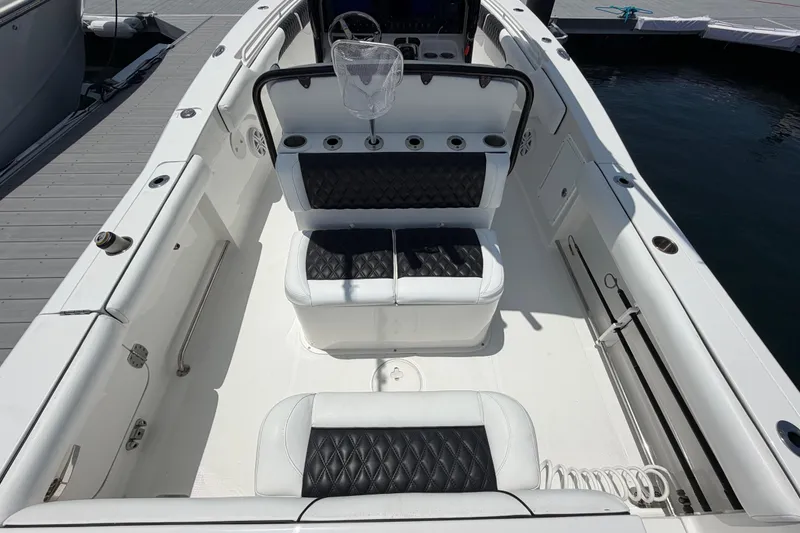 Slide: The Image of 2019 Sea Hunt Gamefish 27 Coffin Box boat interior with cushioned seating. - 8