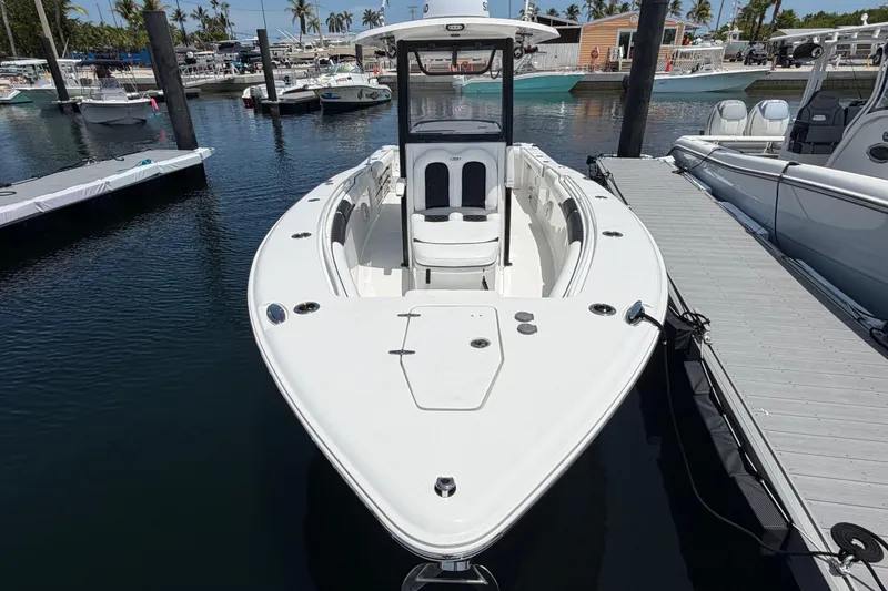 Slide: The Image of 2019 Sea Hunt Gamefish 27 Coffin Box boat docked in a marina. - 5