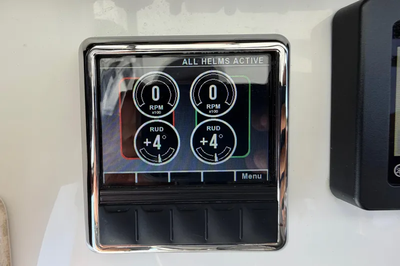 Slide: The Image of Display panel on 2019 Sea Hunt Gamefish 27 Coffin Box showing RPM and rudder angle. - 27