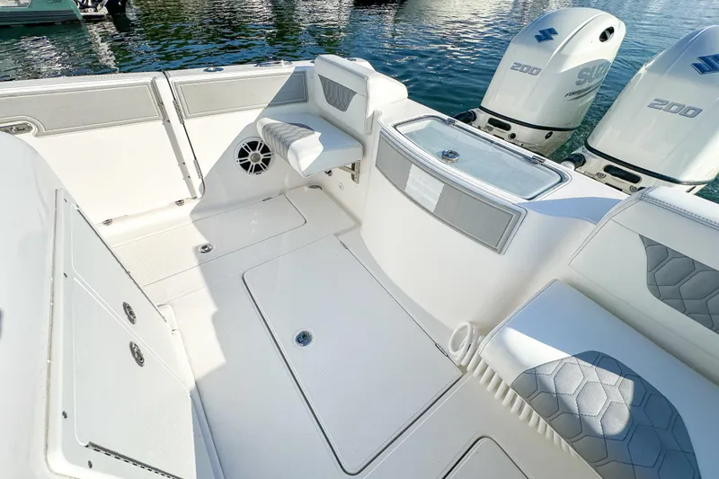 Slide: The Image of 2019 Streamline 26 TE boat interior with seating and dual Suzuki 200 engines. - 31