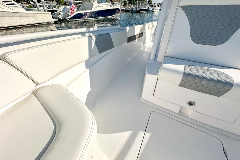 Slide: The Image of Interior of a 2019 Streamline 26 TE boat with cushioned seating. - 30
