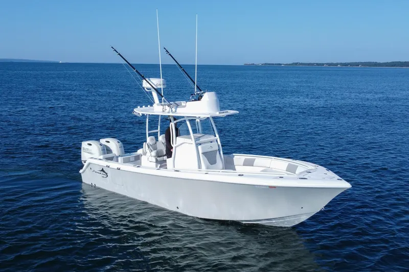 Slide: The Image of 2019 Streamline 26 TE boat on calm blue ocean waters. - 6